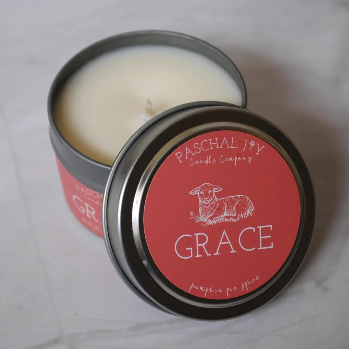 Small candle tin with shot of orange lid