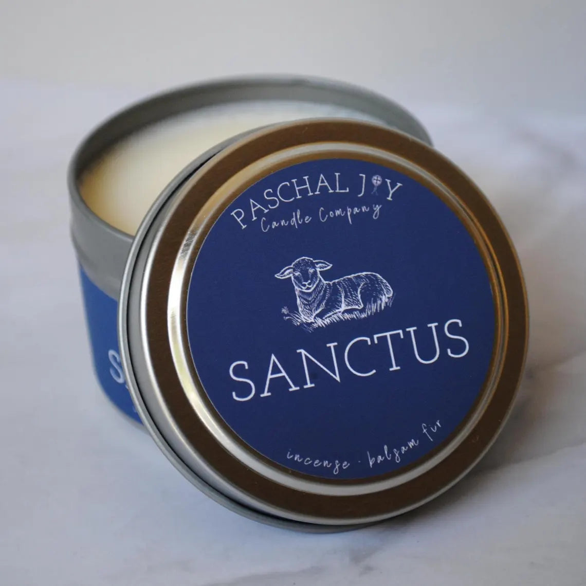 Front of Sanctus Candle Tin