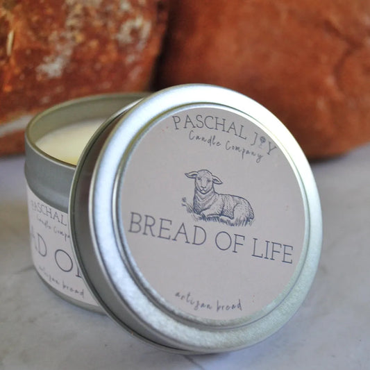 Bread of Life Candle Tin with brown bread in the background.