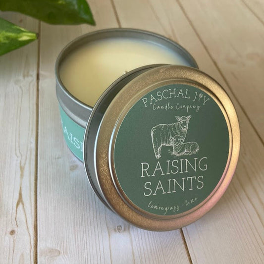 Raising Saints Mini Candle Front of Tin