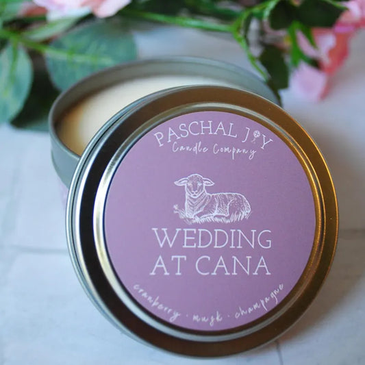 Wedding at Cana Candle Tin with roses in the background
